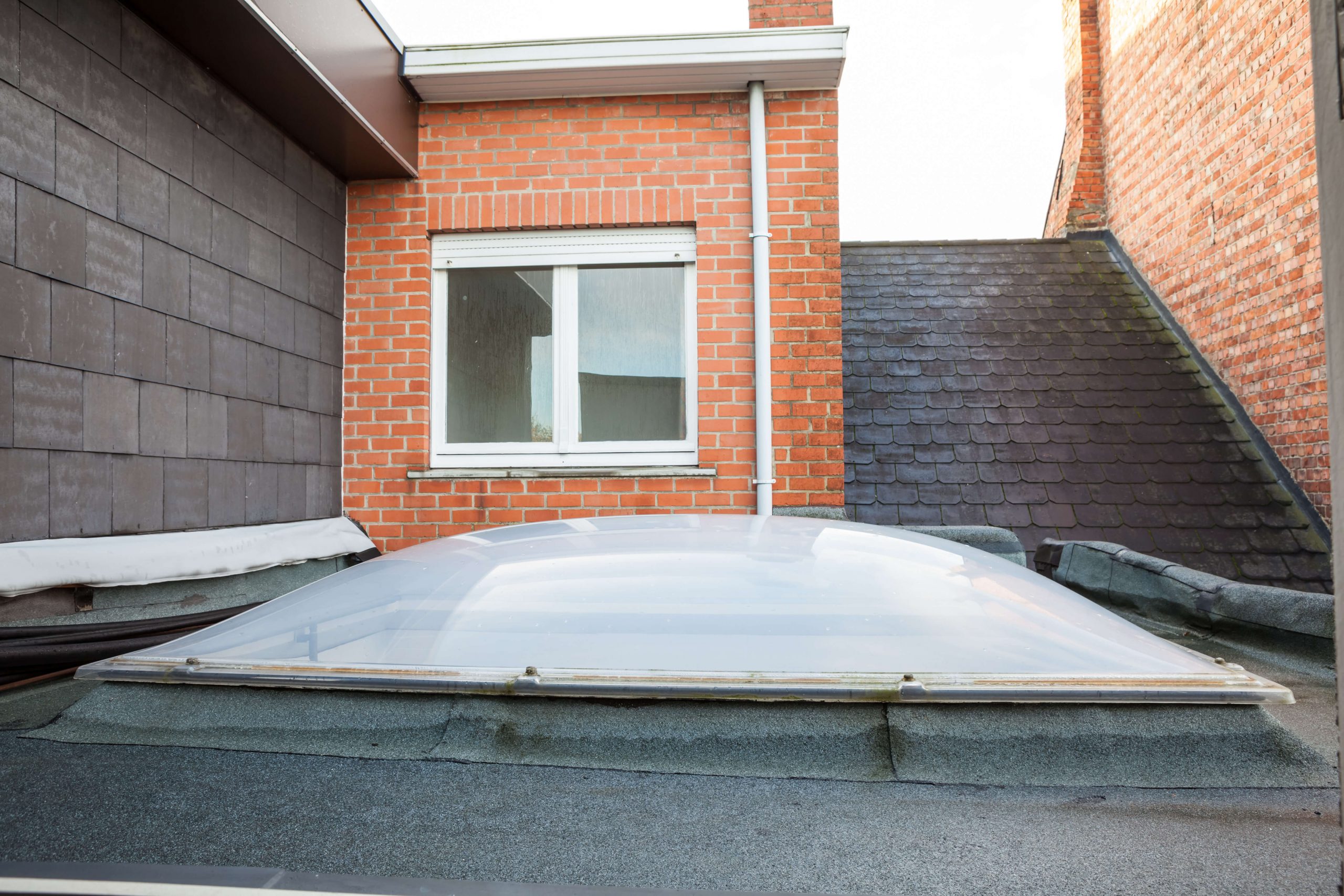 How to spot a damaged flat roof when looking at a property to buy